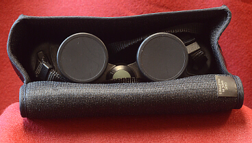 binoculars with lens caps on in case