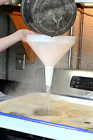 Pouring Sap through Brewing Funnel